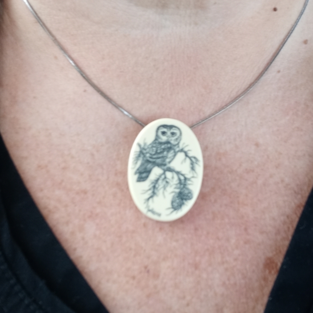 On necklace with bill 16 inch chain included. signed custom jewelry hand painted